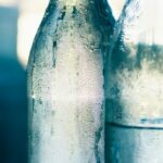 clear glass bottle with water